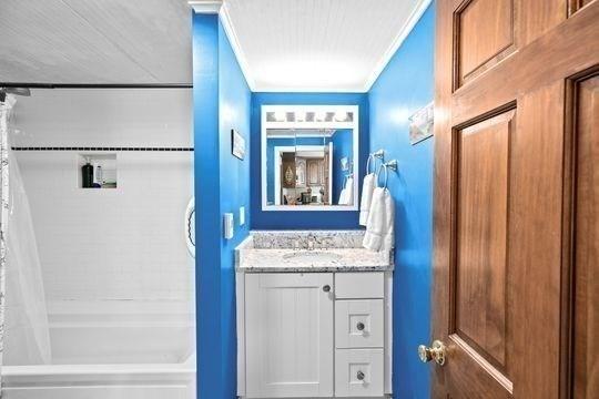 45 Rocky Nook Ave, Kingston, MA 02364 - full bath with ornamental molding, vanity, and shower / tub combo