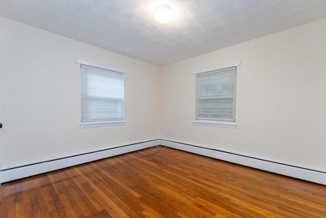 58 Aldrich Rd Unit A, Watertown, MA 02472 - unfurnished room featuring wood finished floors and a baseboard radiator