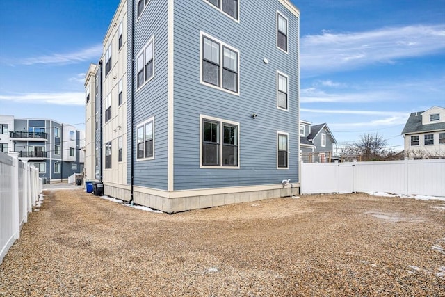 view of property exterior with fence