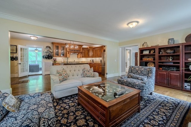 7 Argyle St, Worcester, MA 01609 - living area featuring ornamental molding, light wood-type flooring, and baseboards