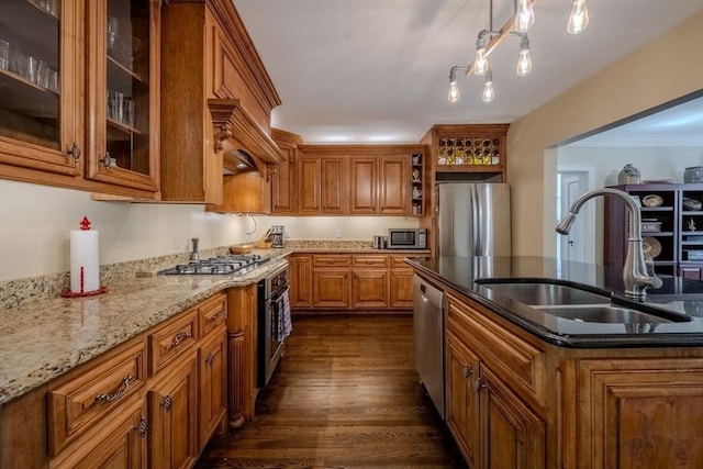 7 Argyle St, Worcester, MA 01609 - kitchen with stainless steel appliances, a sink, brown cabinetry, light stone counters, and open shelves