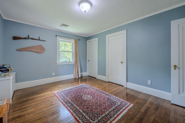7 Argyle St, Worcester, MA 01609 - bedroom featuring wood finished floors, ornamental molding, and baseboards