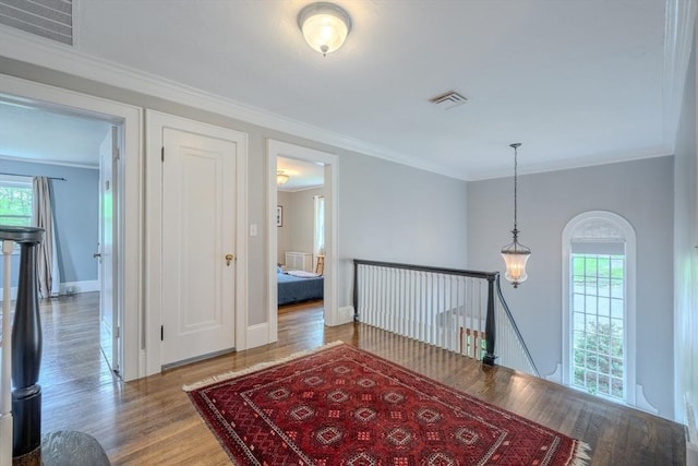 7 Argyle St, Worcester, MA 01609 - hall with an upstairs landing, wood finished floors, baseboards, and crown molding