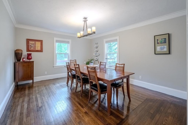 7 Argyle St, Worcester, MA 01609 - dining space featuring crown molding, dark wood-type flooring, baseboards, and a chandelier