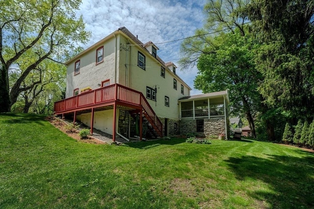 7 Argyle St, Worcester, MA 01609 - back of house featuring stairway, a sunroom, a deck, a lawn, and stucco siding