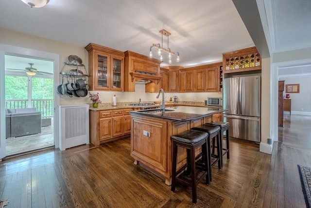 7 Argyle St, Worcester, MA 01609 - kitchen with appliances with stainless steel finishes, a sink, a center island with sink, open shelves, and dark wood-style flooring