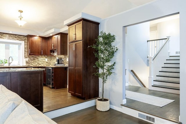 357 Ledge Rd, Seekonk, MA 02771 - kitchen featuring beverage cooler, dark wood-style flooring, visible vents, a sink, and decorative backsplash