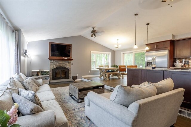 357 Ledge Rd, Seekonk, MA 02771 - living area with a ceiling fan, vaulted ceiling, a fireplace, and wood finished floors