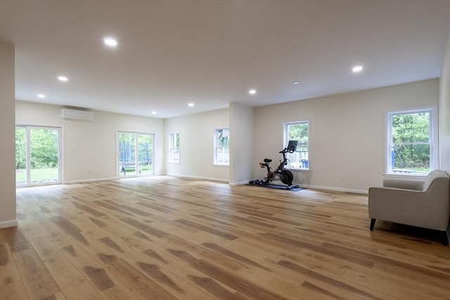 357 Ledge Rd, Seekonk, MA 02771 - interior space with baseboards, light wood-style floors, plenty of natural light, and an AC wall unit