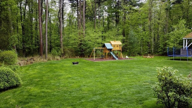 357 Ledge Rd, Seekonk, MA 02771 - view of yard featuring a playground, a trampoline, and a wooded view