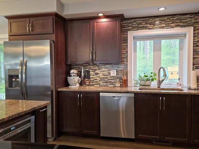357 Ledge Rd, Seekonk, MA 02771 - kitchen featuring recessed lighting, light stone counters, a sink, tasteful backsplash, and appliances with stainless steel finishes