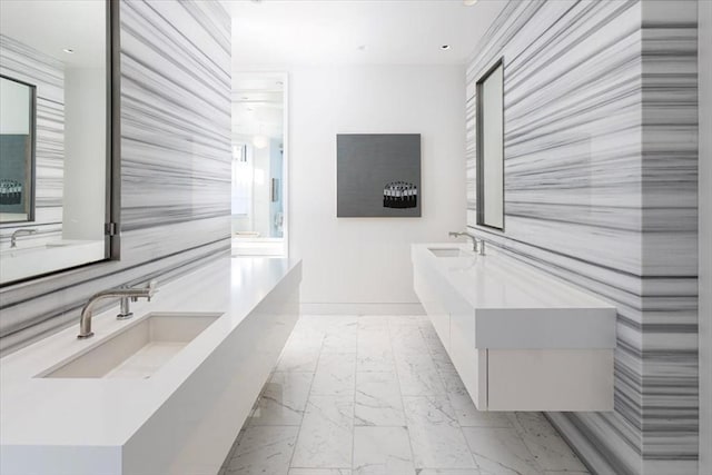 bathroom featuring marble finish floor and vanity