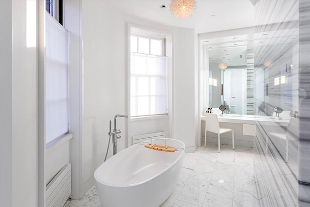 full bath with marble finish floor and a freestanding bath