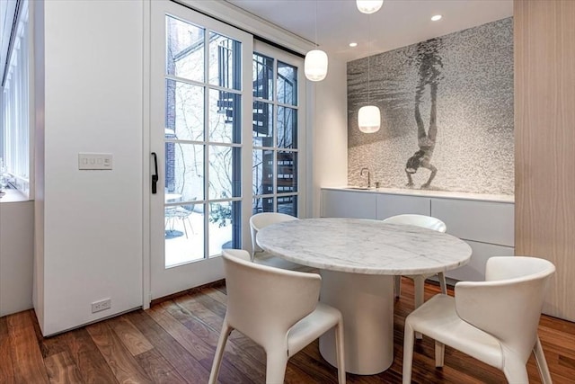 dining area featuring recessed lighting and wood finished floors