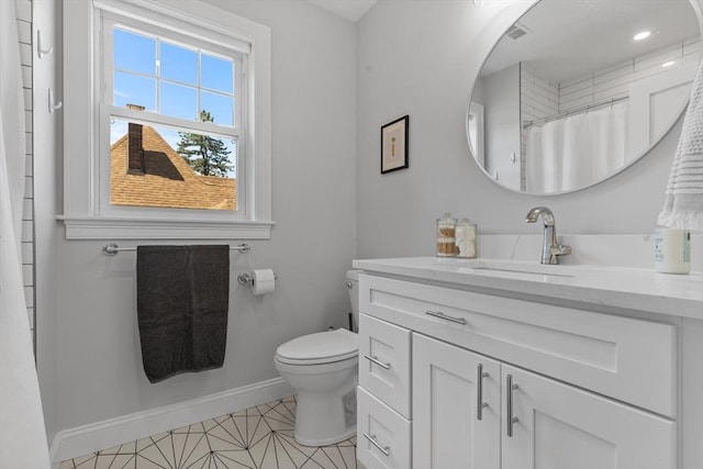 bathroom featuring vanity, toilet, and a shower with curtain