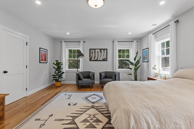 bedroom with light hardwood / wood-style flooring