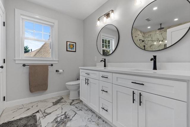 bathroom featuring a shower, toilet, and vanity