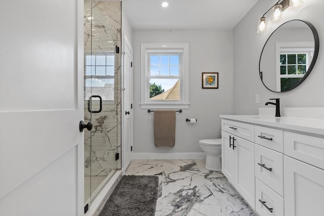 bathroom with toilet, a shower with shower door, and vanity