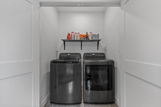 clothes washing area featuring washing machine and dryer