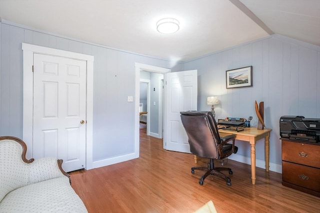 office with light wood-style flooring and baseboards