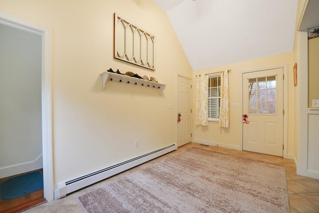 foyer with vaulted ceiling, light tile patterned floors, and a baseboard radiator