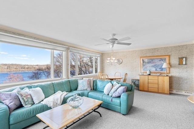 living area with a baseboard radiator, wallpapered walls, light carpet, crown molding, and ceiling fan with notable chandelier