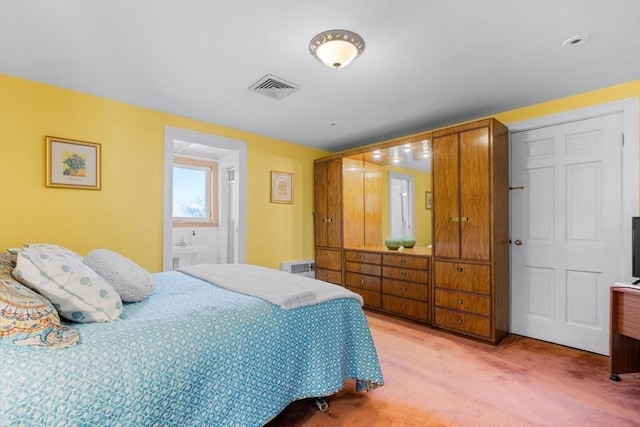 bedroom featuring light carpet and visible vents