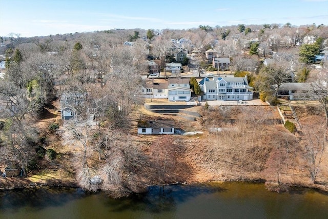 drone / aerial view with a water view and a residential view