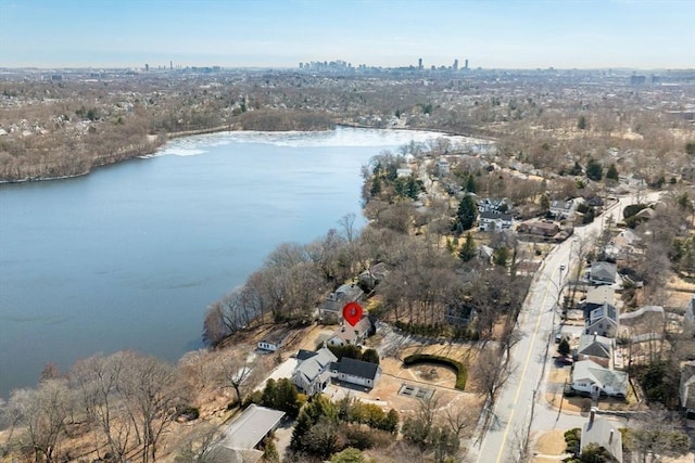 birds eye view of property with a water view