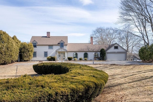 traditional-style house featuring a chimney