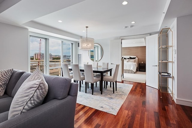 dining area with dark hardwood / wood-style flooring