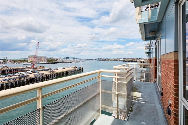 balcony featuring a water view