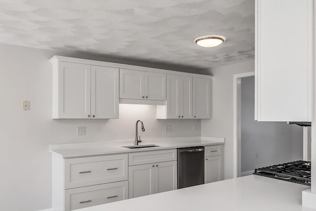 kitchen featuring sink, dishwasher, and white cabinets