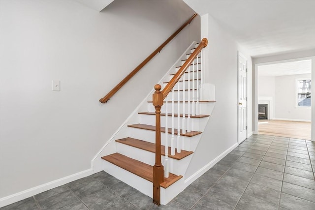 staircase with tile patterned floors