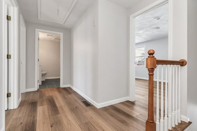 corridor featuring light hardwood / wood-style floors