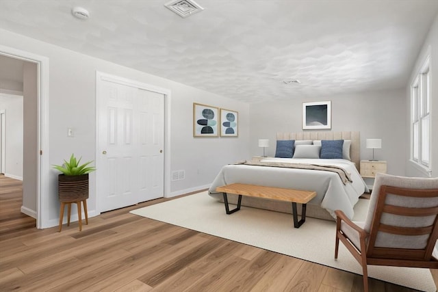 bedroom featuring light wood-type flooring