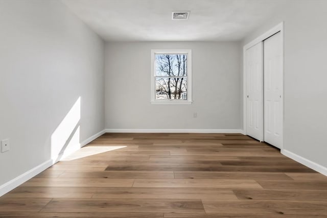 unfurnished bedroom featuring wood-type flooring