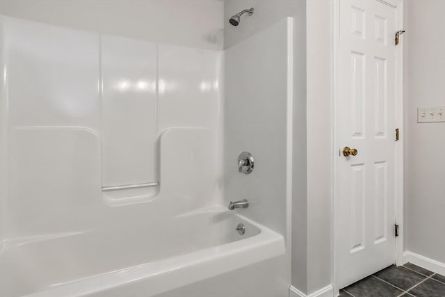 bathroom with tile patterned floors and shower / bathing tub combination