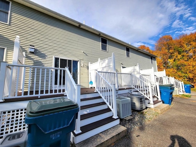 rear view of property with a wooden deck