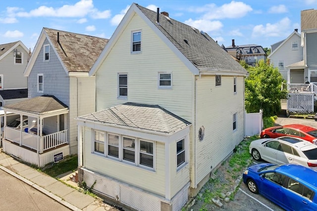 8 Peaceable St, Boston, MA 02135 - rear view of house with a residential view and a shingled roof