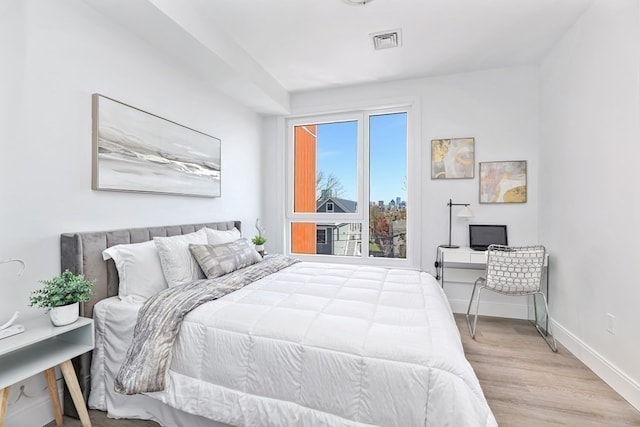 bedroom with light wood-type flooring