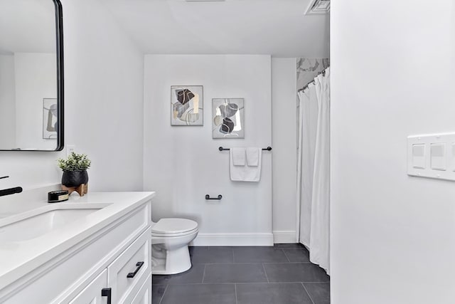 bathroom with tile patterned flooring, a shower with curtain, vanity, and toilet