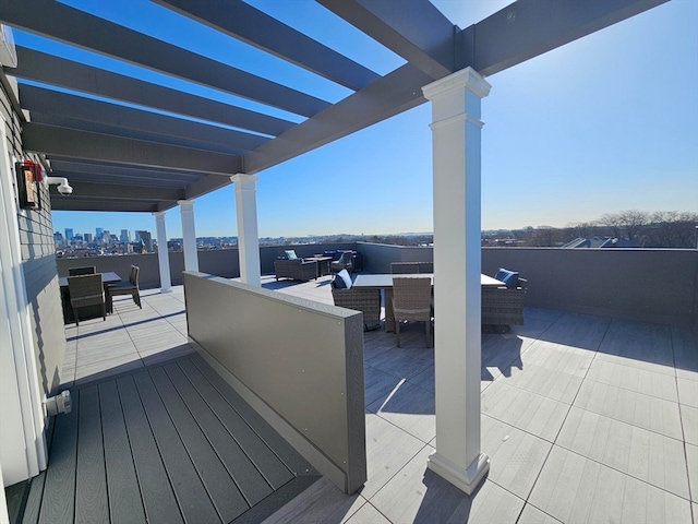 deck featuring an outdoor hangout area and a pergola