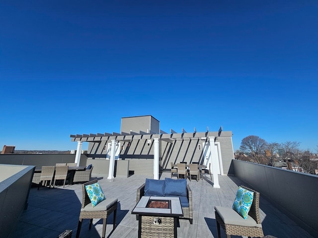 view of patio / terrace featuring a pergola and an outdoor living space with a fire pit