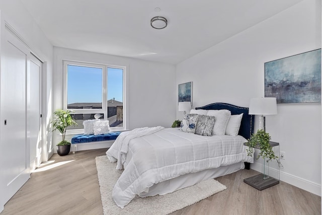 bedroom with light hardwood / wood-style floors