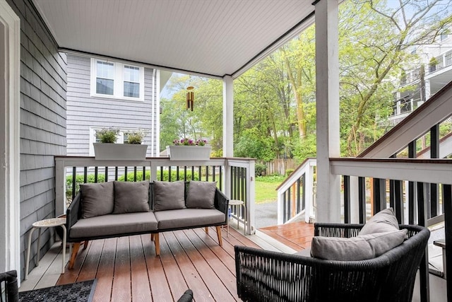 wooden terrace with outdoor lounge area