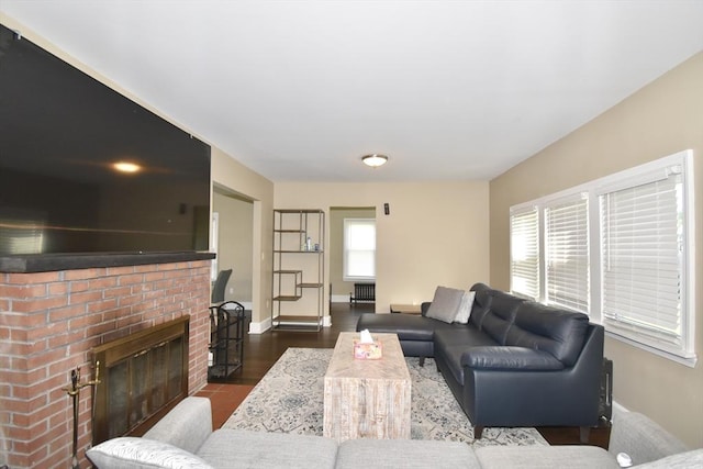 98 Osborne Ter, Springfield, MA 01104 - living area with a fireplace, baseboards, and dark wood finished floors