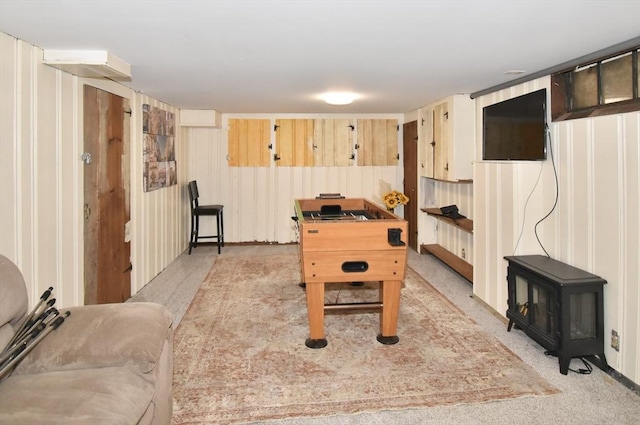 98 Osborne Ter, Springfield, MA 01104 - game room featuring light colored carpet and a wood stove