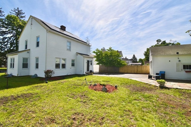 98 Osborne Ter, Springfield, MA 01104 - rear view of property with a patio and a chimney