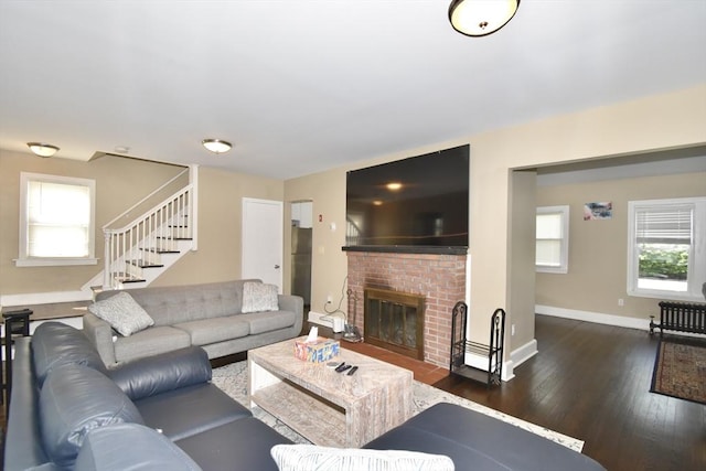 98 Osborne Ter, Springfield, MA 01104 - living area with dark wood-style floors, a fireplace, stairway, and baseboards